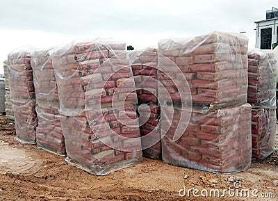 Stock pile of portland cement in commercial bags. Editorial Stock Photo