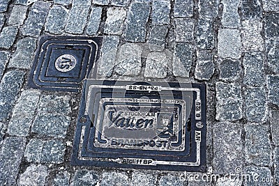 An old hatch in the pavement of Stockholm Editorial Stock Photo