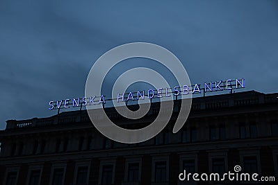 Stockholm, Sweden - July 14, 2019: The neon sign of the Swedish bank Svenska Handelsbanken is mounted on their headquarters Editorial Stock Photo