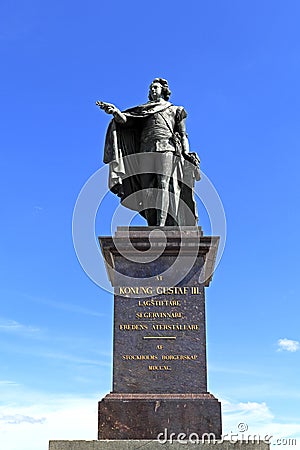 Stockholm / Sweden - 2013/08/01: Old town quarter Gamla Stan - King Gustav III monument by the Royal Palace Editorial Stock Photo