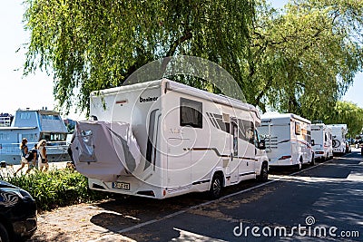 Stockholm, Sweden, 08.04.2021: Parking for caravan travel trailer RV motor home camper. Car vehicle journey. Tourism Summer Editorial Stock Photo
