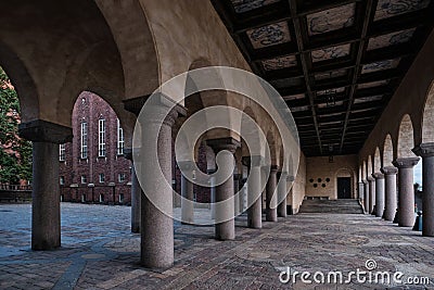 The collonnade arch passage and brick facade at the Town City hall of Stockholm Editorial Stock Photo