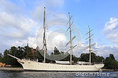 Stockholm / Sweden - 2013/08/01: Skeppsholmen island - yacht serving as a hostel - docked by the Balti sea shoreline Editorial Stock Photo