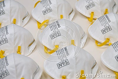 Stockpile of N95 Respirator Dust Masks from Side View Stock Photo