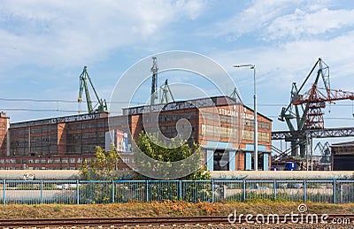Stocznia Gdanska Gdansk Shipyard, view of the prefabrication workshop and heavy cranes. Editorial Stock Photo