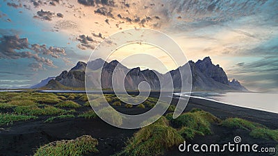 Stokksnes cape in Iceland during sunrise. Vestrahorn mountains. Amazing Iceland nature seascape Stock Photo