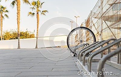 Stolen bicycle, Chained bicycle wheel, front wheel locked Stock Photo