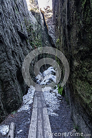 Stolowe Mountains National Park. Path in Rock Labyrinth hiking trail Bledne Skaly. Errant Rocks in Sudetes Mountains near Kudowa- Stock Photo