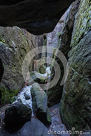 Stolowe Mountains National Park. Path in Rock Labyrinth hiking trail Bledne Skaly. Errant Rocks in Sudetes Mountains near Kudowa- Stock Photo