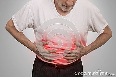 Stomach ache, man placing hands on the abdomen Stock Photo