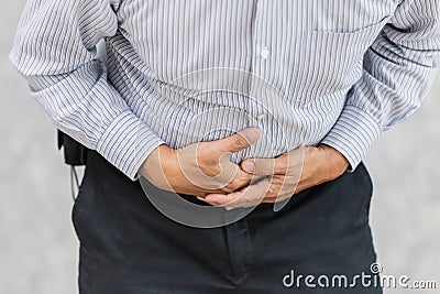 Stomachache pain hand cover Stock Photo