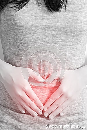 Stomachache in a woman isolated on white background. Clipping path on white background. Stock Photo