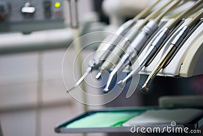 Stomatological instrument in the dentists clinic. Operation, tooth replacement. Stock Photo