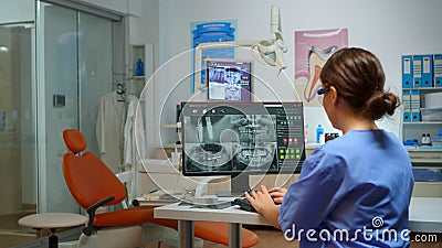 Stomatological nurse inviting patient in dental room Stock Photo