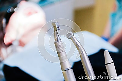 Stomatological tool kit. Closeup hightech Dentist equipments. Dental treatment at the dentist, a client sitting in a dental chair Stock Photo