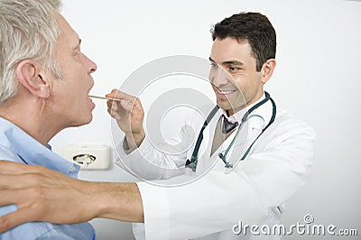 Stomatologist Checking Patient's Throat Stock Photo