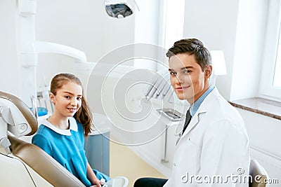 Stomatology. Dentistry Doctor And Patient In Dentist Office Stock Photo