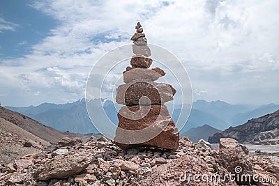 Stone Ð¡airn in mountains Stock Photo