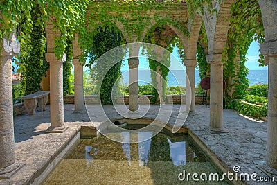 Stone arches of a garden pavilion in Royal Palace in Balchik, Bulgaria Stock Photo