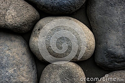 Stone background. Wall of rounded pebbles Stock Photo