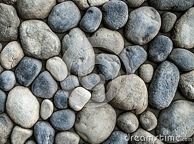 Stone background. Wall of rounded pebbles Stock Photo