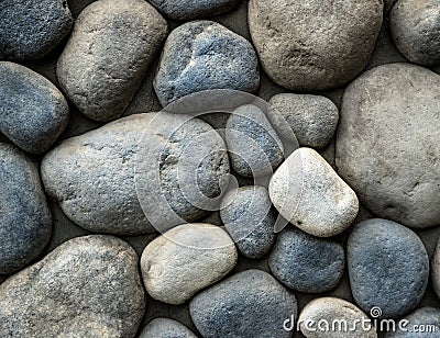 Stone background. Wall of rounded pebbles Stock Photo