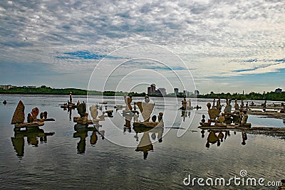 Stone balance on the river bank with reflection in the water Editorial Stock Photo