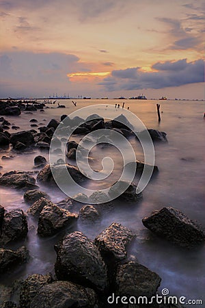 Stone at beach sunsets view wave Stock Photo