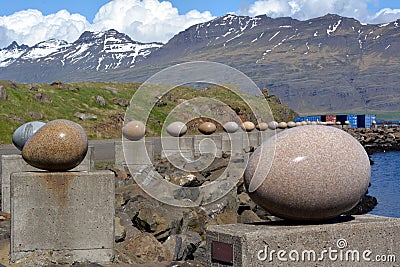Stone bird eggs on the seafront in Djupivogur in Iceland. Summer 2017 Editorial Stock Photo