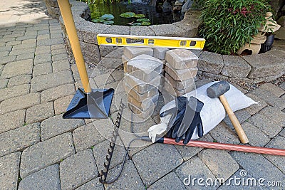 Stone Brick Pavers with Garden Tools Stock Photo