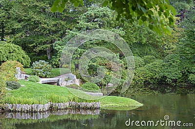 Stone bridge across ponds Stock Photo