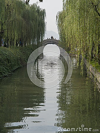 Stone bridge cross water channel at westlake hangzhou Stock Photo