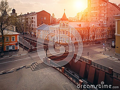 Stone Bridge in historical center of Voronezh at sunset. Old buildings and road intersection in European city downtown Stock Photo