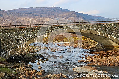 Stone Bridge over Creek on Isle of Skye Scotland UK Stock Photo