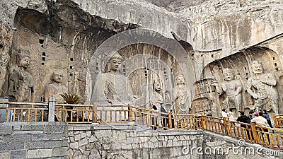 Stone Buddha statue in Longmen Grottoes, Luoyang Editorial Stock Photo