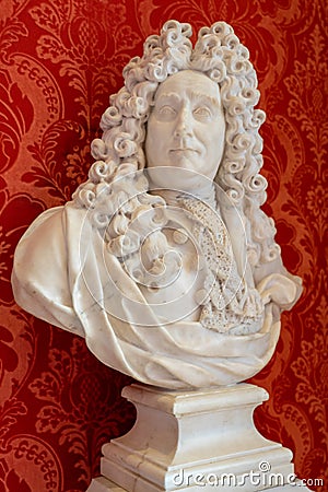 stone bust of georges mareschales with a red background at the museum of versailles. Editorial Stock Photo
