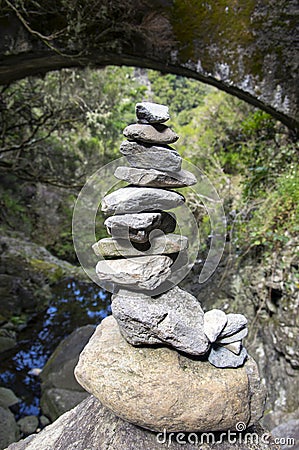 Stone cairn under the bridge, Rabacal, Madeira island, Portugal Stock Photo