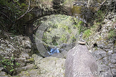 Stone cairn under the bridge, Rabacal, Madeira island, Portugal Stock Photo