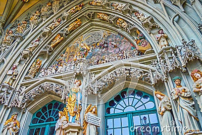 The stone carved relief of the entrance portal of Bern Minster, Switzerland Editorial Stock Photo