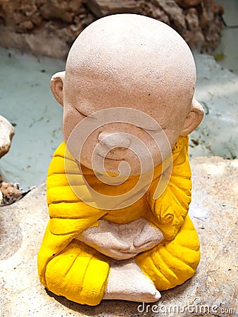 Stone carving of a little Buddha Meditation Stock Photo