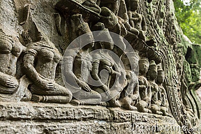 Stone carving at Ta Prohm Tomb Raider temple in Angkor Archaeological Park, Siem Reap, Cambodia Editorial Stock Photo