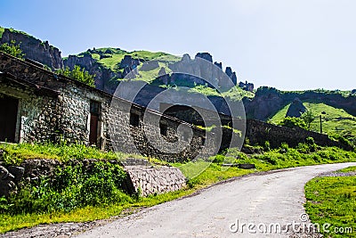 Stone construction, road and rocks on background Stock Photo