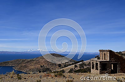 Stone cottage with thatched roof on Isla del Sol in Lake Titicaca, Bolivia. Stock Photo