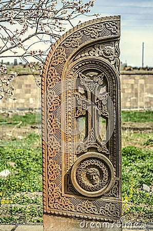 Stone cross carved with ornaments in the form of the sixteenth letter of the Armenian alphabet,created by Mesrop Mashtots in the Editorial Stock Photo