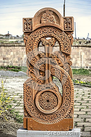 Stone cross carved with ornaments in the form of the thirty-first letter of the Armenian alphabet, created by Mesrop Mashtots in Editorial Stock Photo