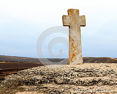 Stone Cross near church Stock Photo