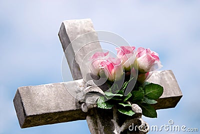 Stone Cross with Pink Roses Stock Photo