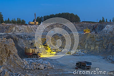 Stone crusher in a quarry. mining industry, night view Stock Photo