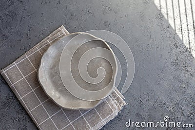 Stone curl gray platter on conrete table Stock Photo