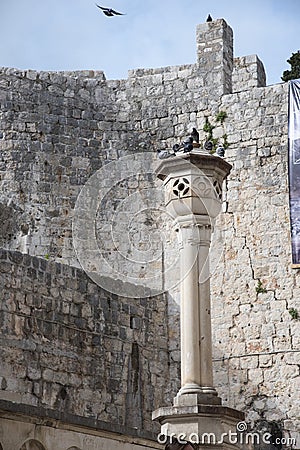 Stone decorations on the entrance ramp through the stone wall to the old town of Dubrovnik, Croatia Stock Photo